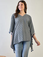 The luxurious poly crepe fabric flowing elegantly on the kaftan top.