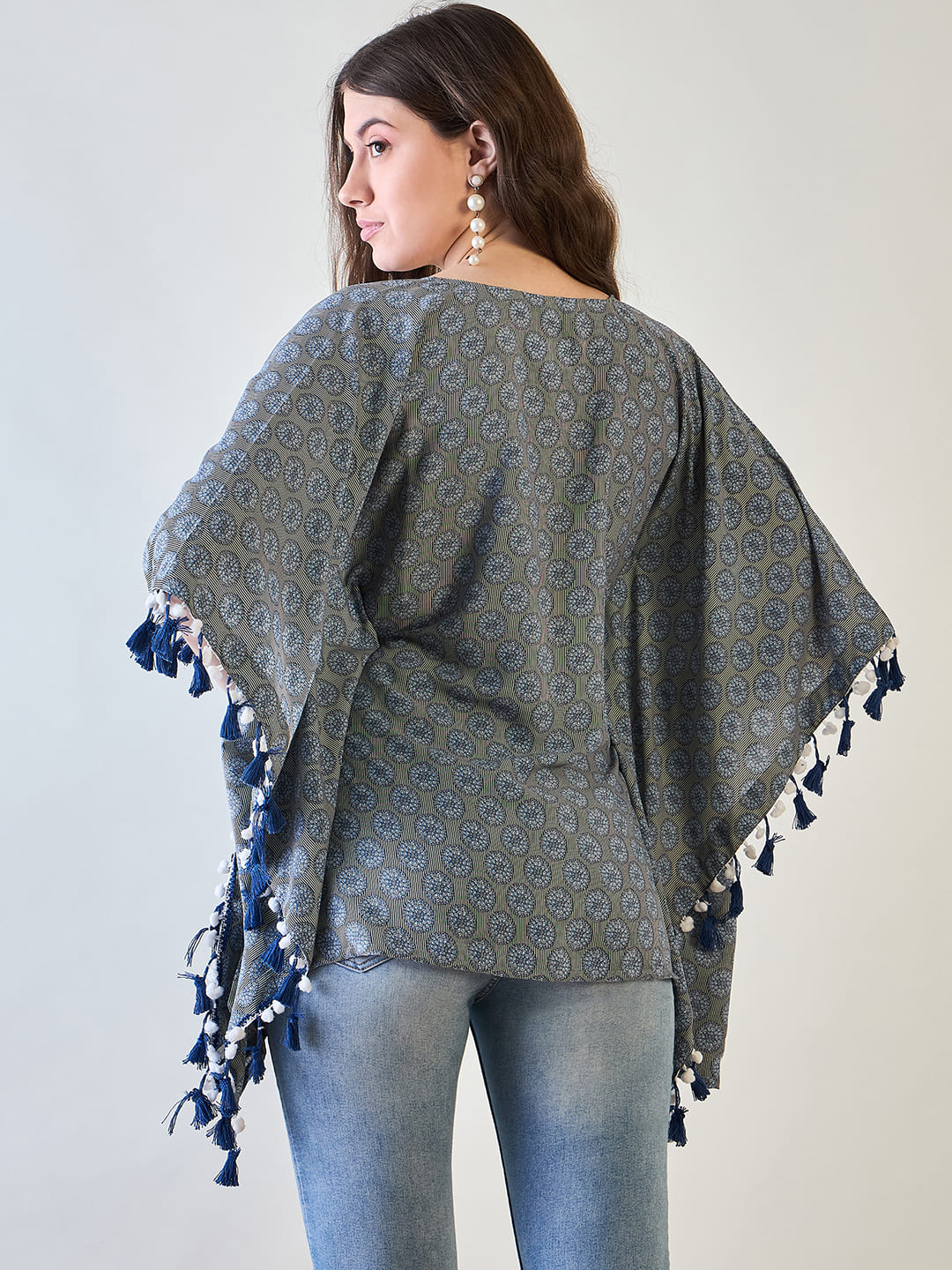 Tassel accent on the sleeve and collar of the stylish poly crepe kaftan top