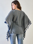 Tassel accent on the sleeve and collar of the stylish poly crepe kaftan top