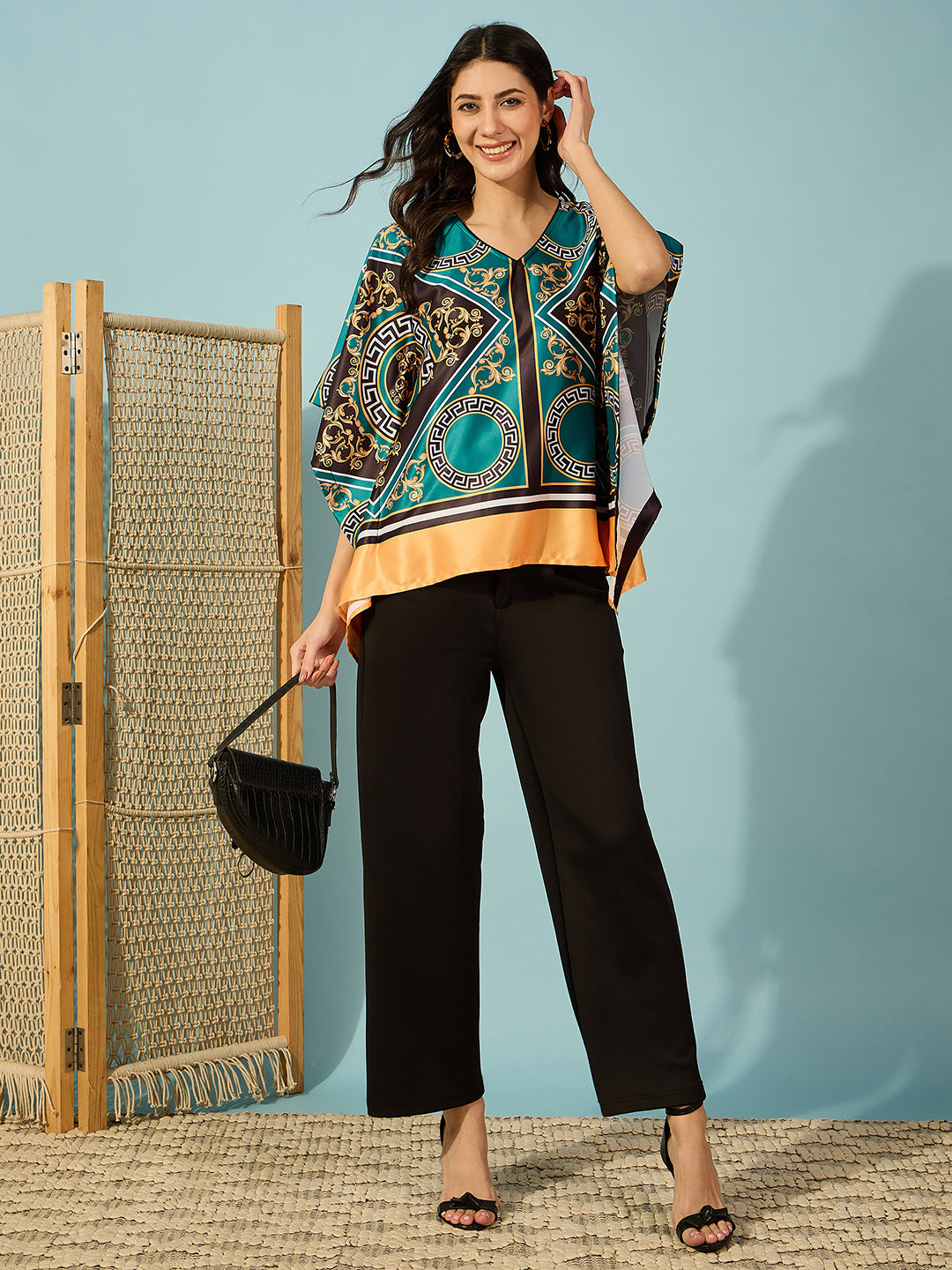 Bold and beautiful: Women's teal baroque printed top with a flowy kaftan design.
