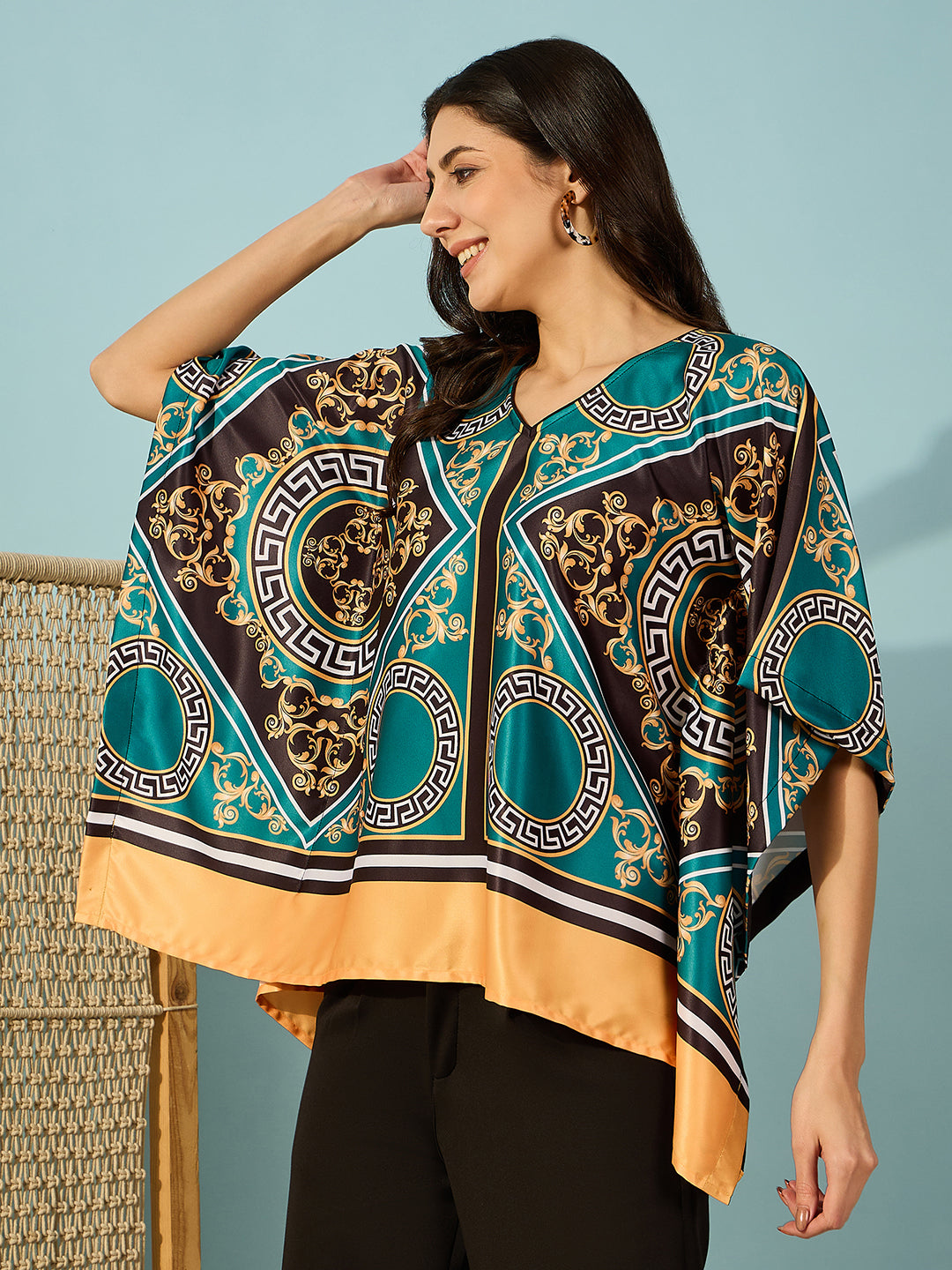 Chic and trendy teal kaftan top for women, featuring a bold baroque print.
