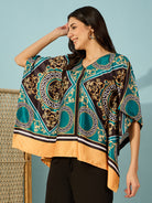 Chic and trendy teal kaftan top for women, featuring a bold baroque print.
