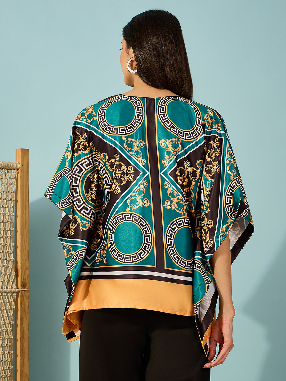 Stay stylish with this women's kaftan-inspired teal top, adorned with a stunning baroque print.
