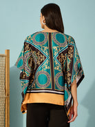 Stay stylish with this women's kaftan-inspired teal top, adorned with a stunning baroque print.
