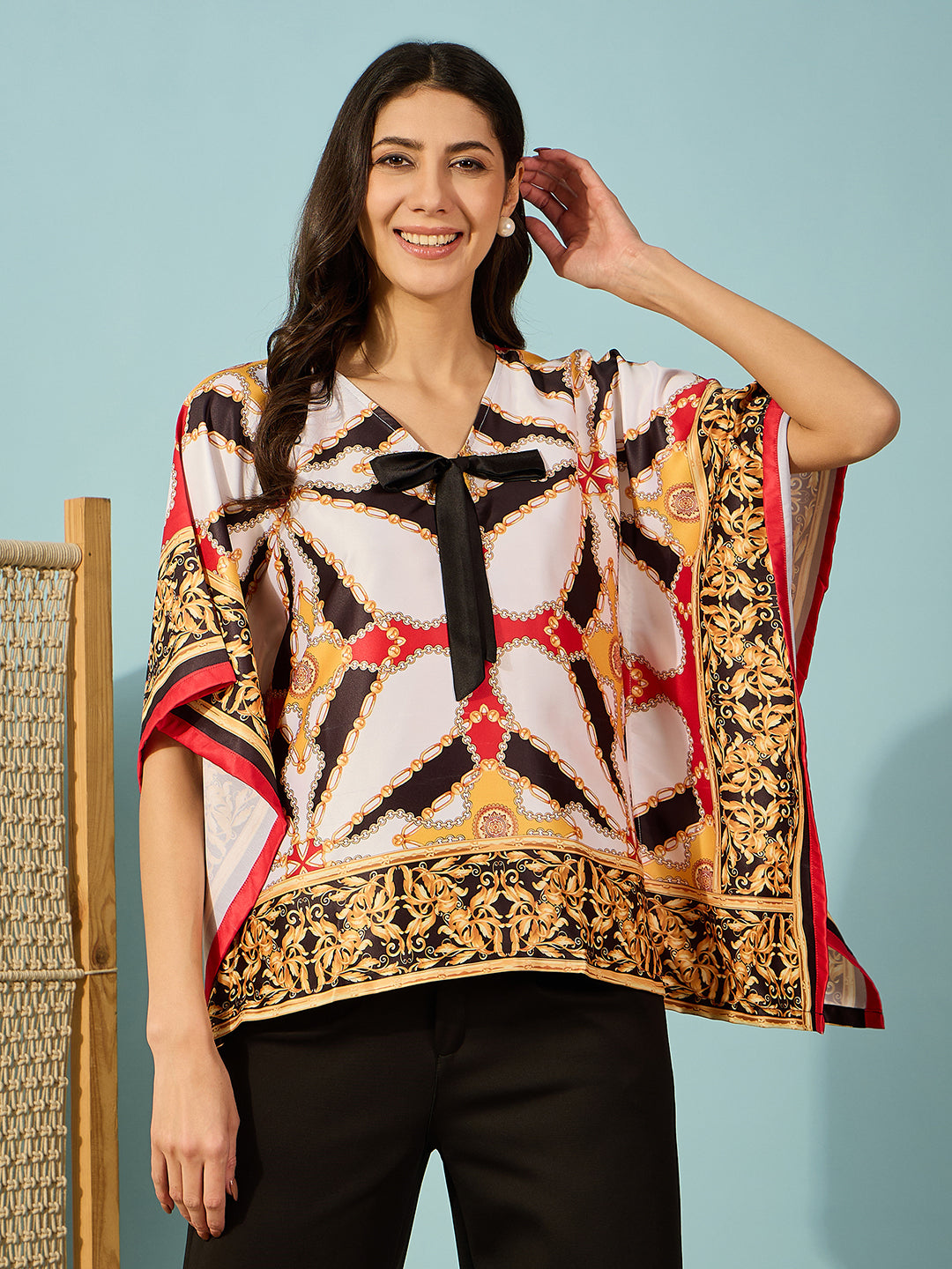 Black satin kaftan top with Baroque print and chic bow detail â‚¬€œ perfect for a fashionable, elegant look.
