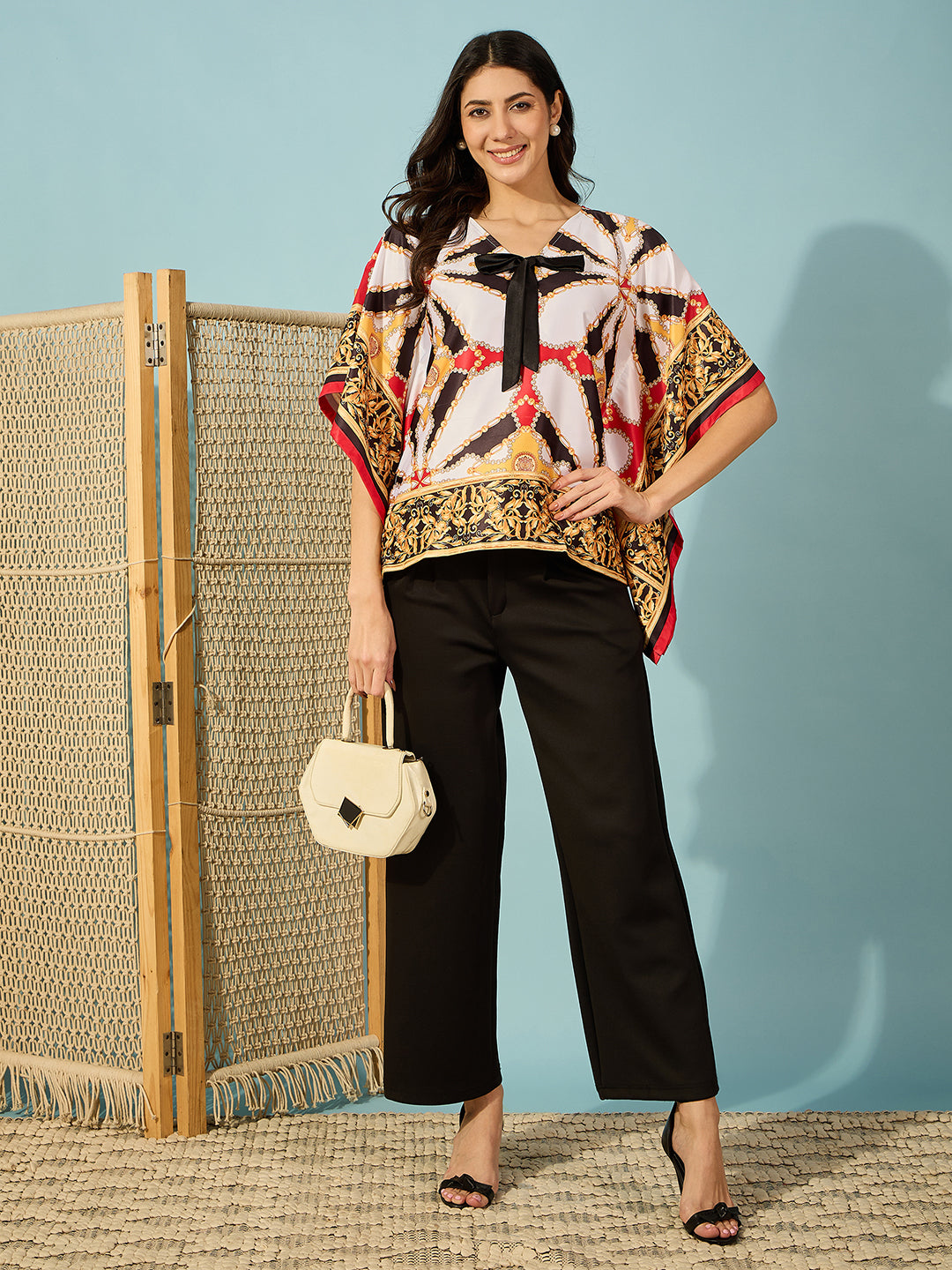 Black Baroque satin kaftan top with a bow â‚¬€œ perfect for pairing with high-waisted jeans or skirts.
